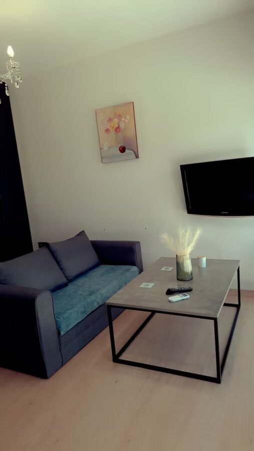 Living area with sofa, artwork and coffee table