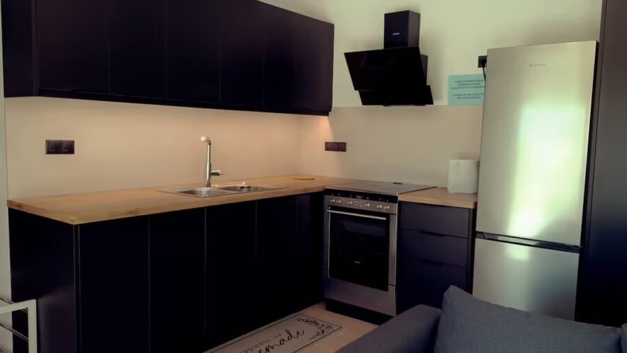 Open-plan kitchen with wooden worktop