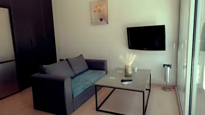 Sitting area with coffee table and television
