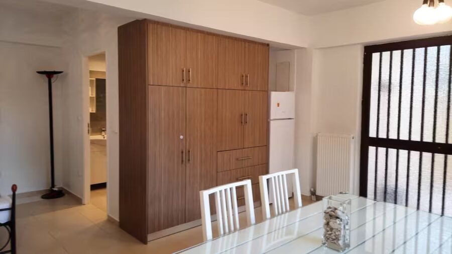 Interior of the studio with wardrobe and dining table